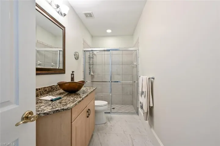 Guest Bathroom with Bowl Sink and Tile Shower