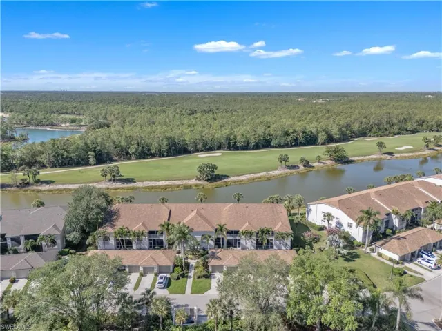 Bird's eye view featuring a forest view, a residential view, golf course view, and a water view