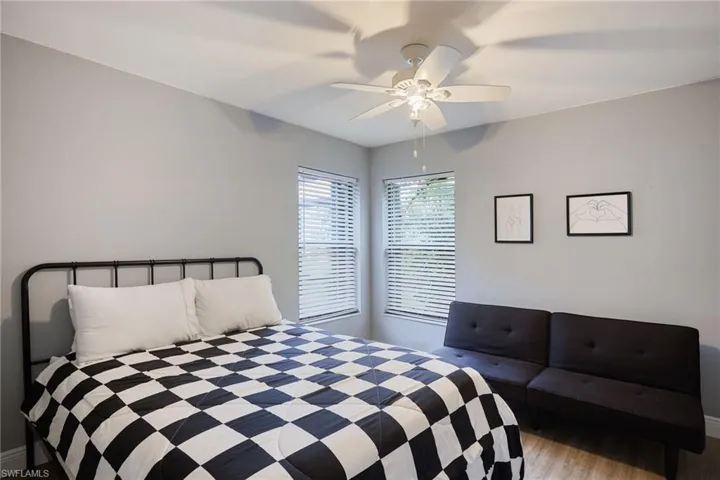Bedroom featuring light wood-type flooring and ceiling fan