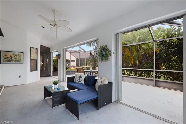 Sunroom featuring ceiling fan