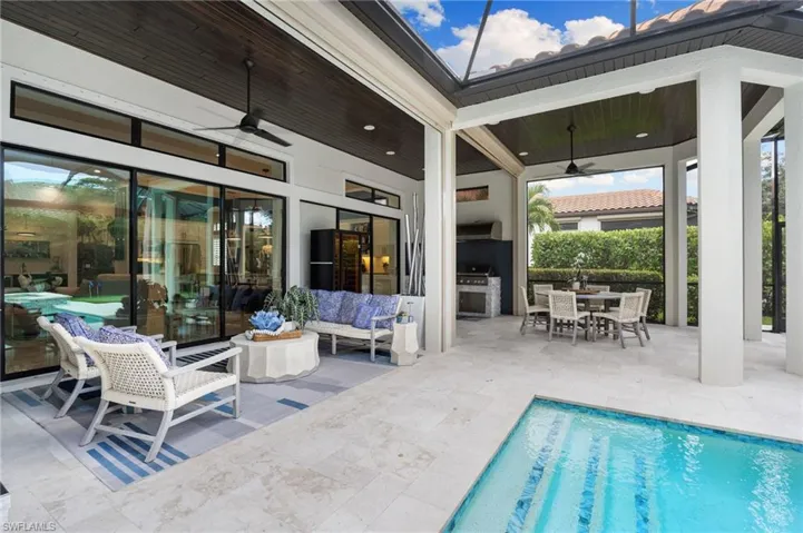View of patio featuring a ceiling fan, outdoor dining space, an outdoor living space, and area for grilling