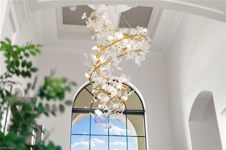 Detailed view of crown molding and arched walkways