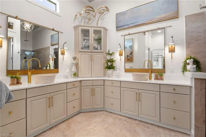 Full bathroom featuring double vanity and ornamental molding