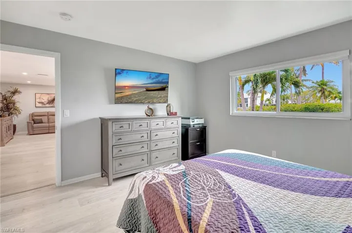 Bedroom with light wood-type flooring and baseboards