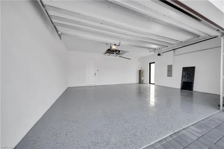 Garage with electric panel and water heater