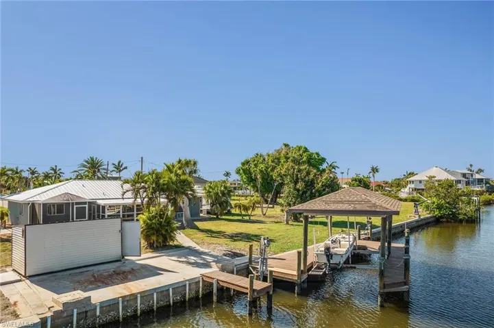 Aerial of boat lift and storage shed.
