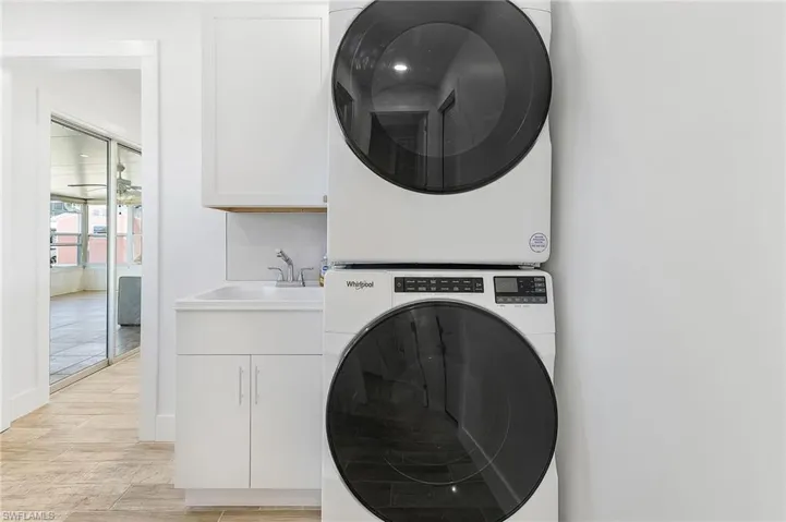 Laundry inside home with sink.