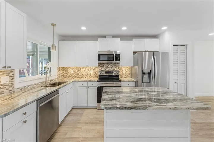 Stainless appliances and granite counters.