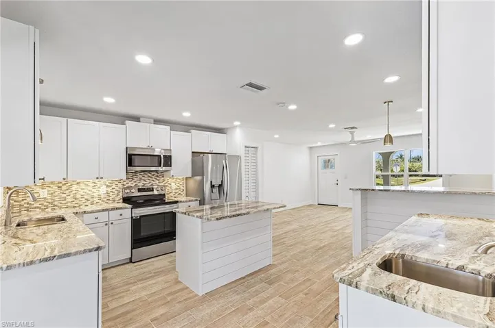Kitchen has lots of counter space and cabinets.