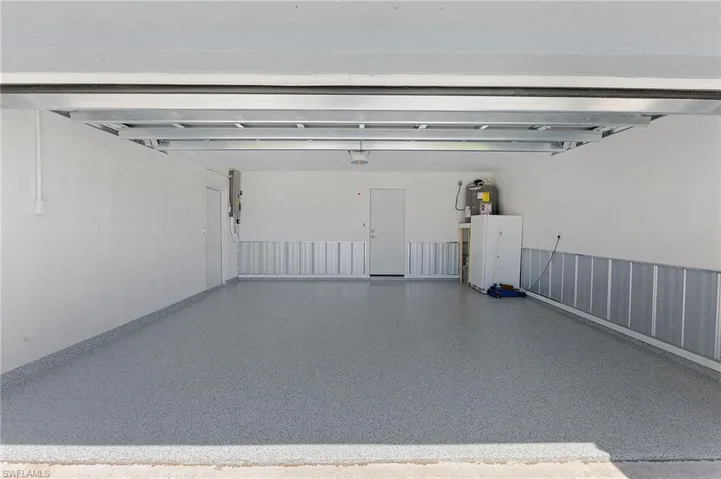Two car garage with epoxy floors.
