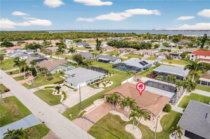 Aerial perspective of suburban area with a large body of water