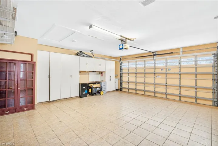 Garage featuring a garage door opener