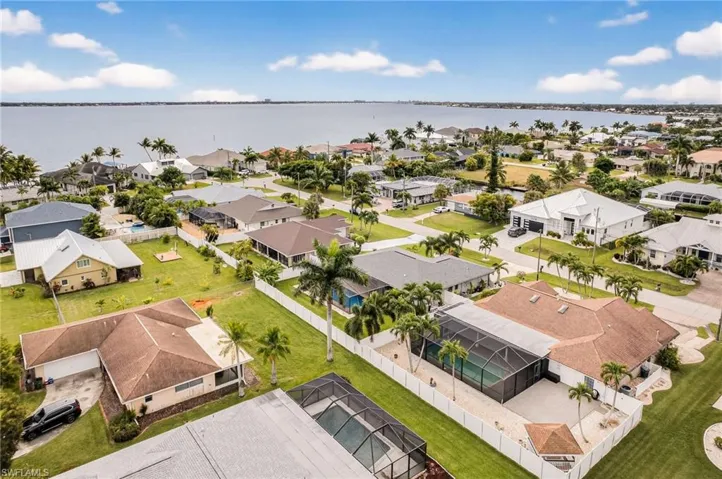Aerial view of residential area with a nearby body of water
