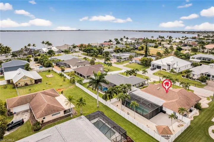 Aerial view of residential area with a nearby body of water