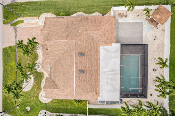 View of subject property featuring a pool area