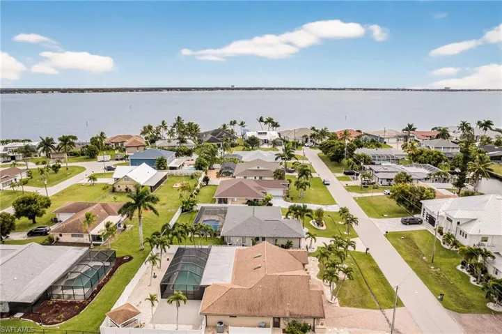 Aerial view of residential area with a large body of water