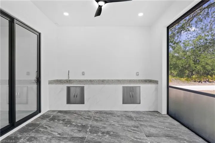 Unfurnished room featuring recessed lighting, ceiling fan, and marble finish floor