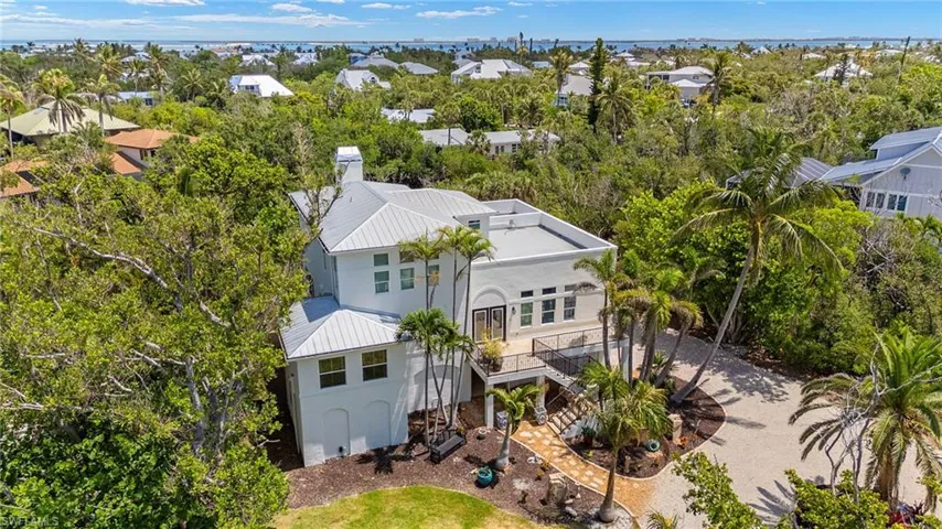 Aerial view of residential area with a tree filled landscape