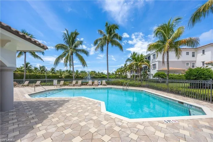 Community pool featuring a patio