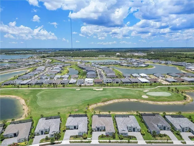 Golf course frontage with water features, surrounded by a residential community