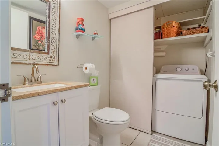 Updated bathroom with full sized dryer and additional storage