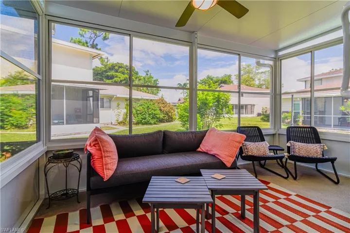 Sunroom tastefully furnished featuring ceiling fan and plenty of natural light