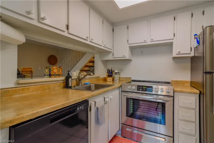 Kitchen with passthrough to living area