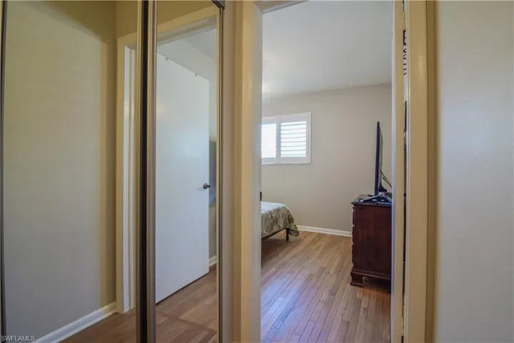 Unfurnished bedroom featuring wood-type flooring