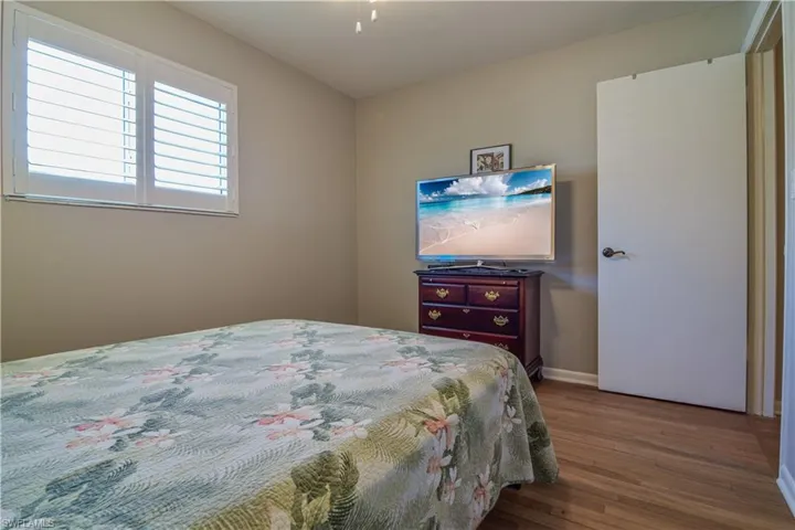 Bedroom featuring dark wood-type flooring