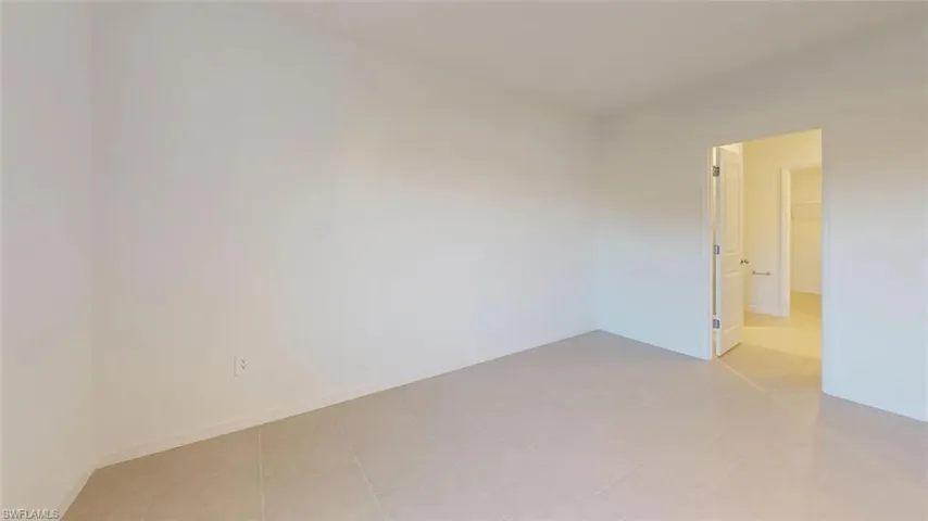 Neutral wall tones with tile flooring