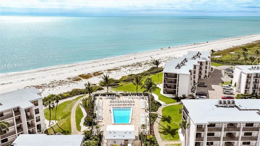 Aerial view of waterfront with a beach