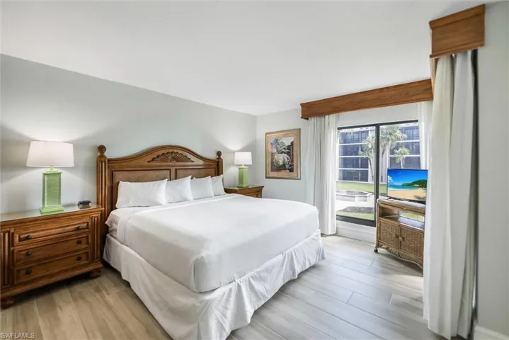 Bedroom featuring light wood-style flooring and access to outside