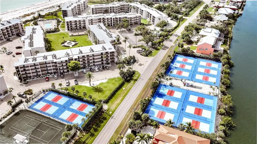 Bird's eye view of apartment complex / building and expansive coastline