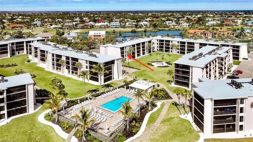 Bird's eye view of apartment complex and a large body of water