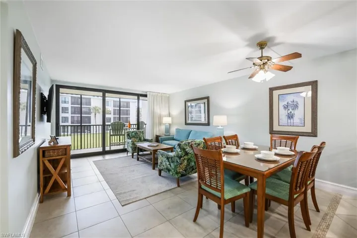 Dining room featuring light tile patterned flooring and expansive windows