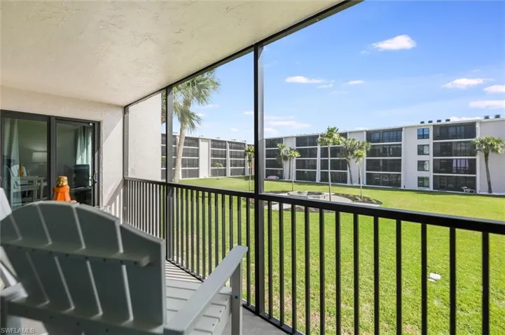 Balcony featuring a sunroom