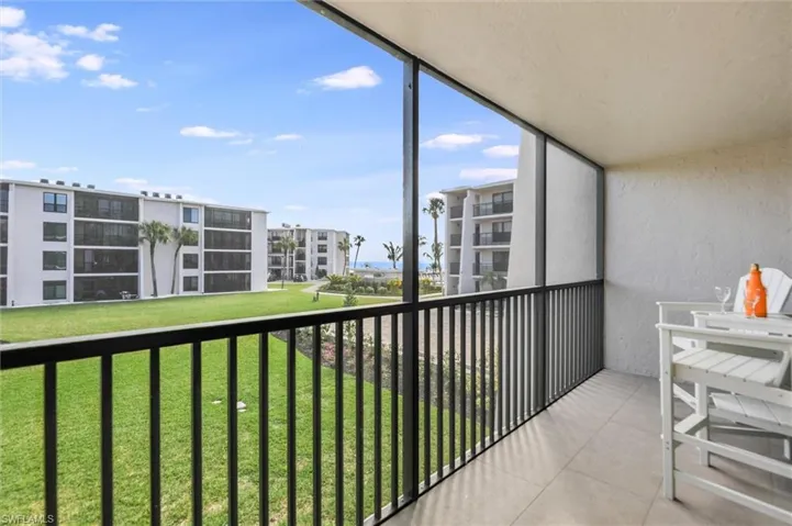 Balcony featuring a sunroom
