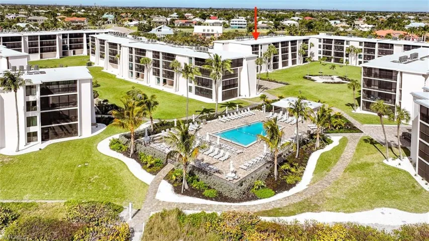 Bird's eye view of apartment complex / building and a pool