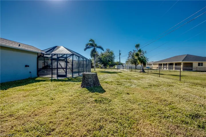 View of yard with a lanai