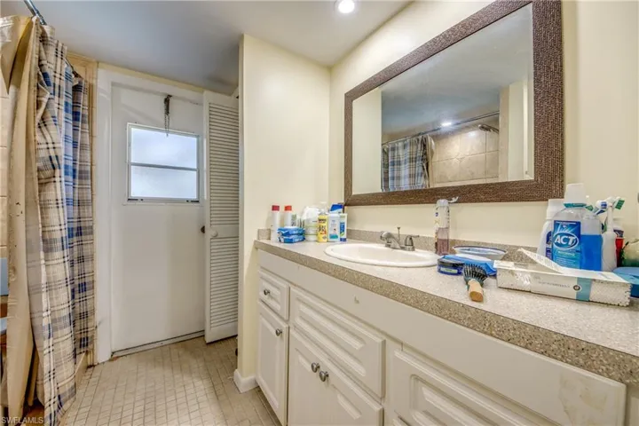 Bathroom featuring tile patterned floors and vanity