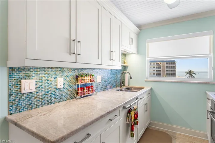 Custom Sea-glass tiled backsplash and Gulf views from the kitchen too!