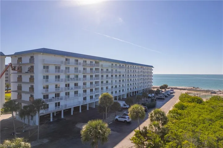Back of structure. "A" building is the one closest to the Beach. UNDER BUILDING PARKING SPOT #11 IS INCLUDED.