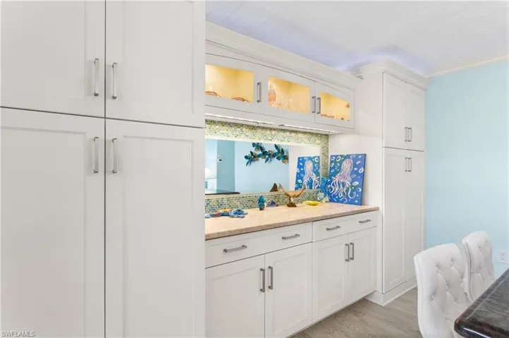 Kitchen has been extended for additional counter and cabinet space. Lighted glass cabinets.