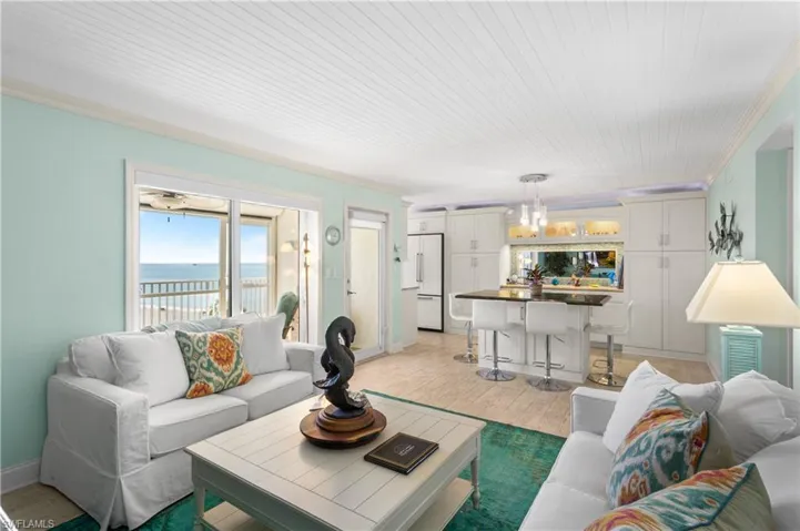 Open floor plan opening up to kitchen, dining, and front balcony...ideal for entertaining.