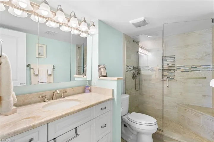 Custom tiled shower, new vanity/lighting/plumbing. Heavy glass shower doors!