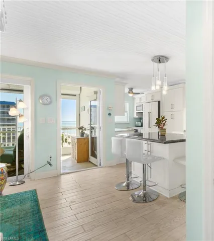 Custom beadboard ceilings and wood-like tile throughout the condo!