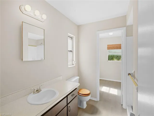 Bathroom featuring wood finished floors and vanity