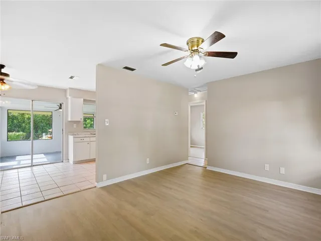 Unfurnished room featuring a ceiling fan and light wood finished floors