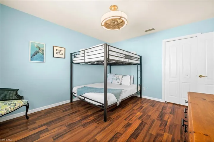 Bedroom No. 3, also painted in calming hues, has a walk-in closet.