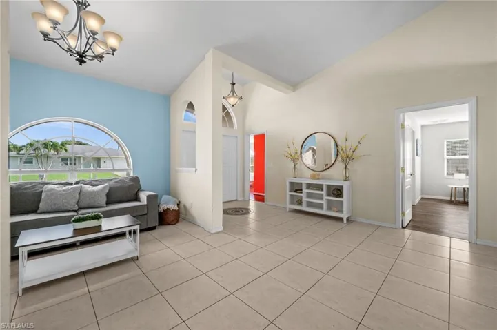 The dining room offers a pleasant view of the foyer, the den, and the primary suite.